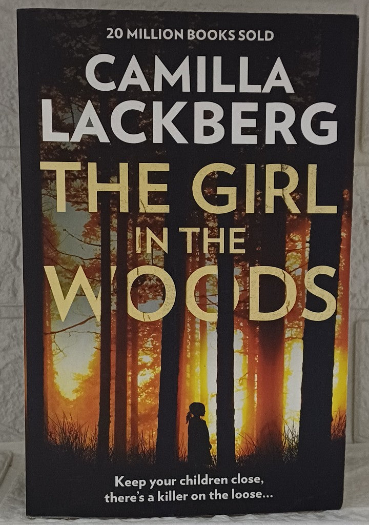 Front Cover Of The Girl in the Woods (Patrik Hedstrom and Erica Falck #10) (Camilla Läckberg