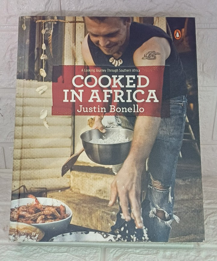 Front Cover Of Cooked In Africa (Justin Bonello)