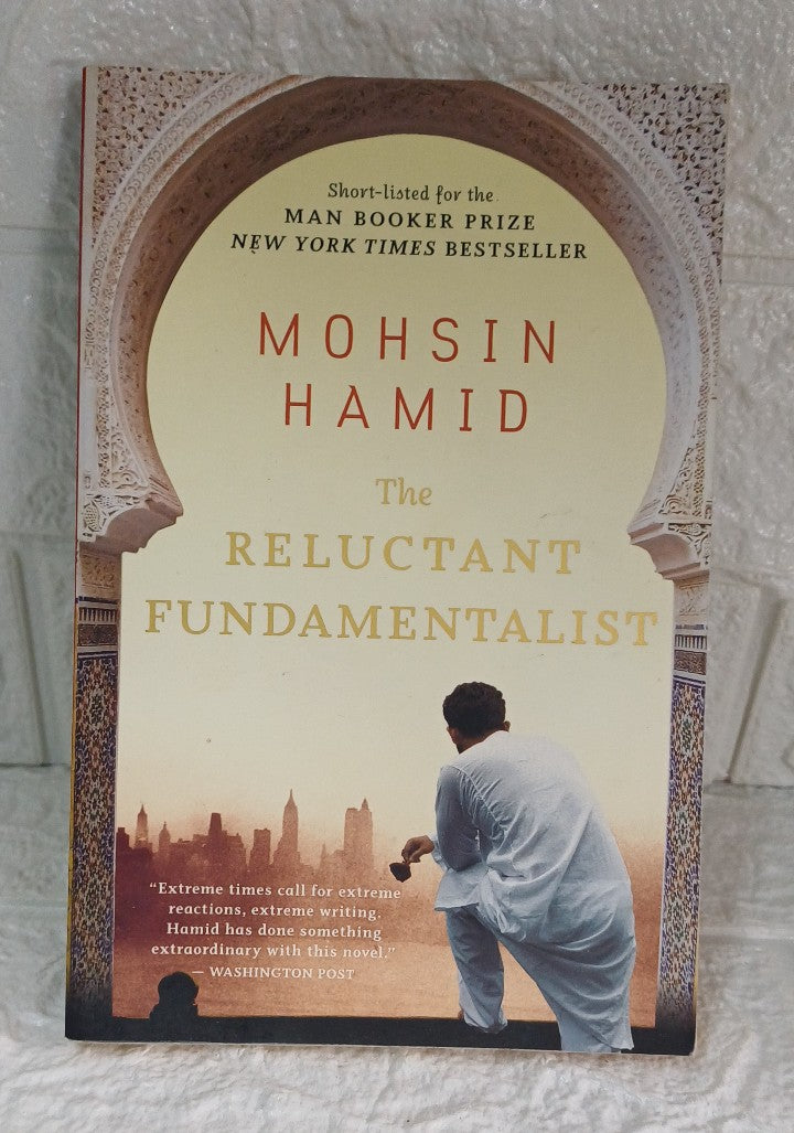 Front Cover Of The Reluctant Fundamentalist: A Man Booker Prize-Shortlisted Literary Novel of Love, Identity, and the American Dream (Mohsin Hamid)
