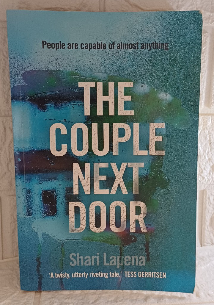 Front Cover Of The Couple Next Door (Shari Lapena)