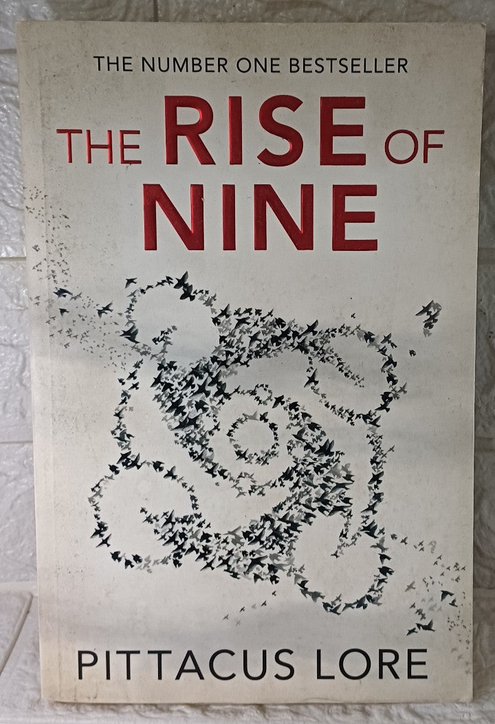 Front Cover Of The Rise Of Nine (Lorien Legacies, #3) (Pittacus Lore)