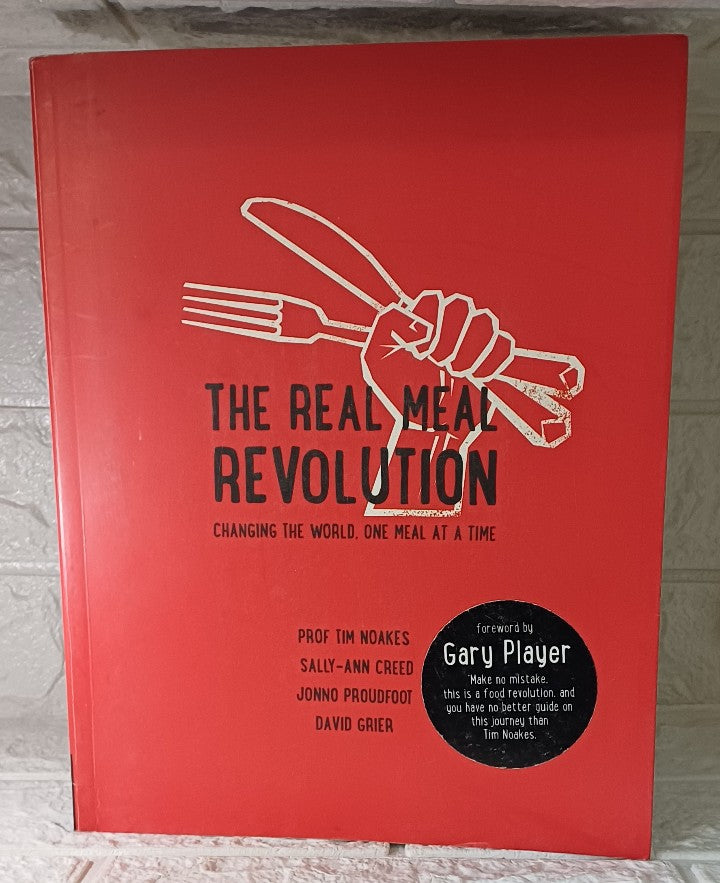 Front Cover Of The Real Meal Revolution (Tim Noakes; Sally-Ann Creed; Jonno Proudfoot; David Grier)