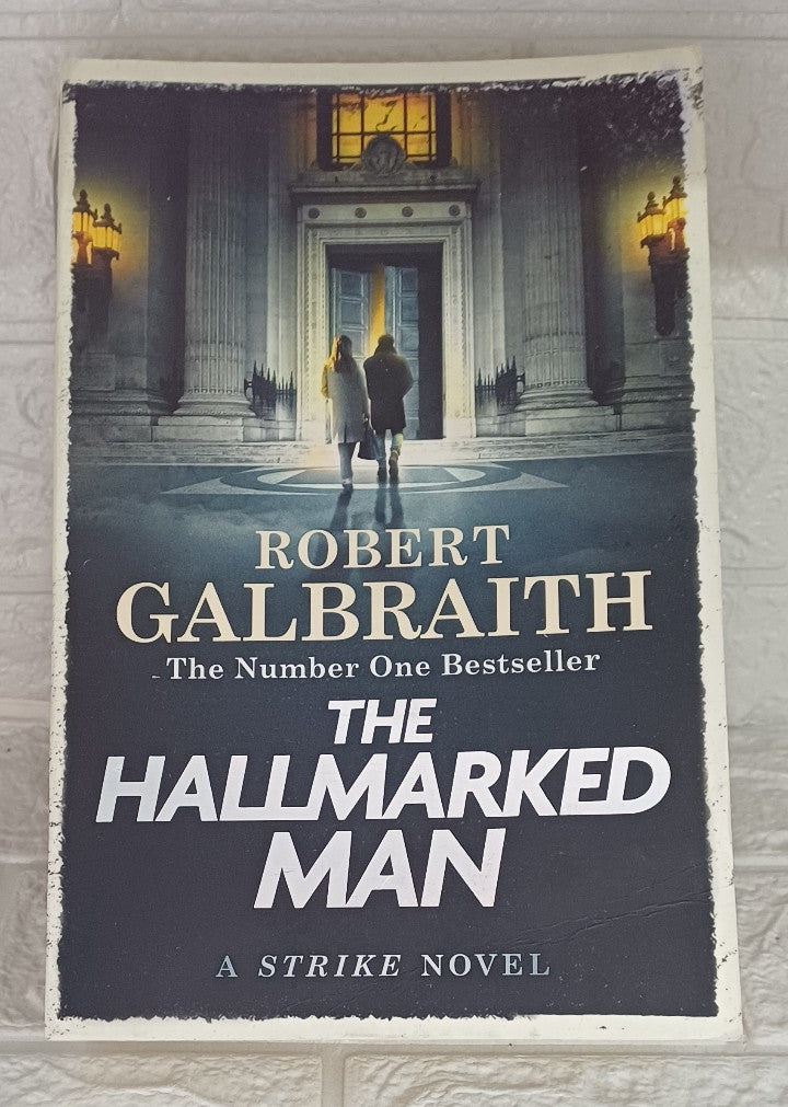 Front Cover Of The Hallmarked Man (Cormoran Strike, #8) (Robert Galbraith)