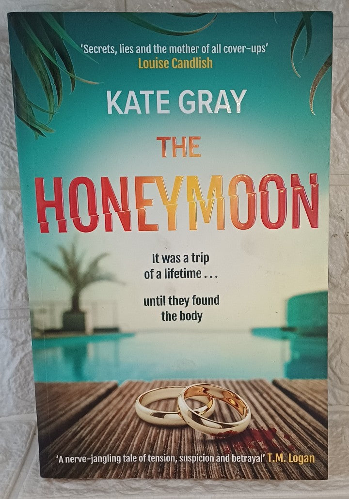 Front Cover Of Mountain Leopard Press The Honeymoon a completely addictive and gripping psychological thriller perfect for holiday reading. (Kate Gray)