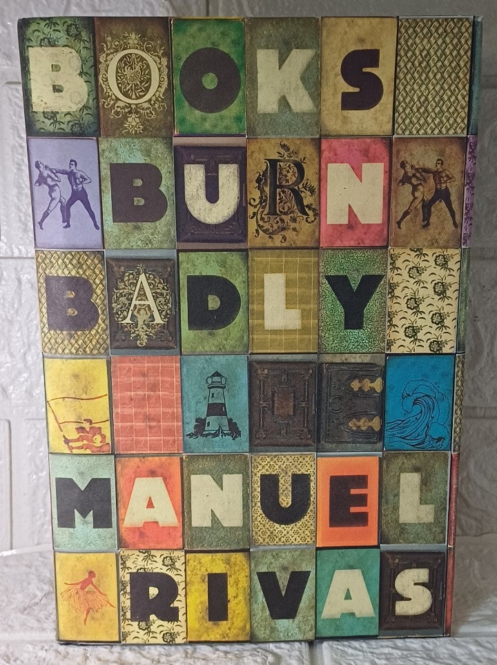 Front Cover Of Books Burn Badly (Manuel Rivas; Jonathan Dunne)