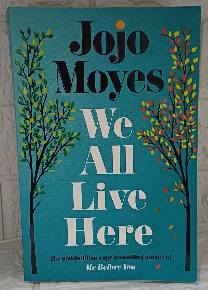 Front Cover Of We All Live Here (Jojo Moyes)
