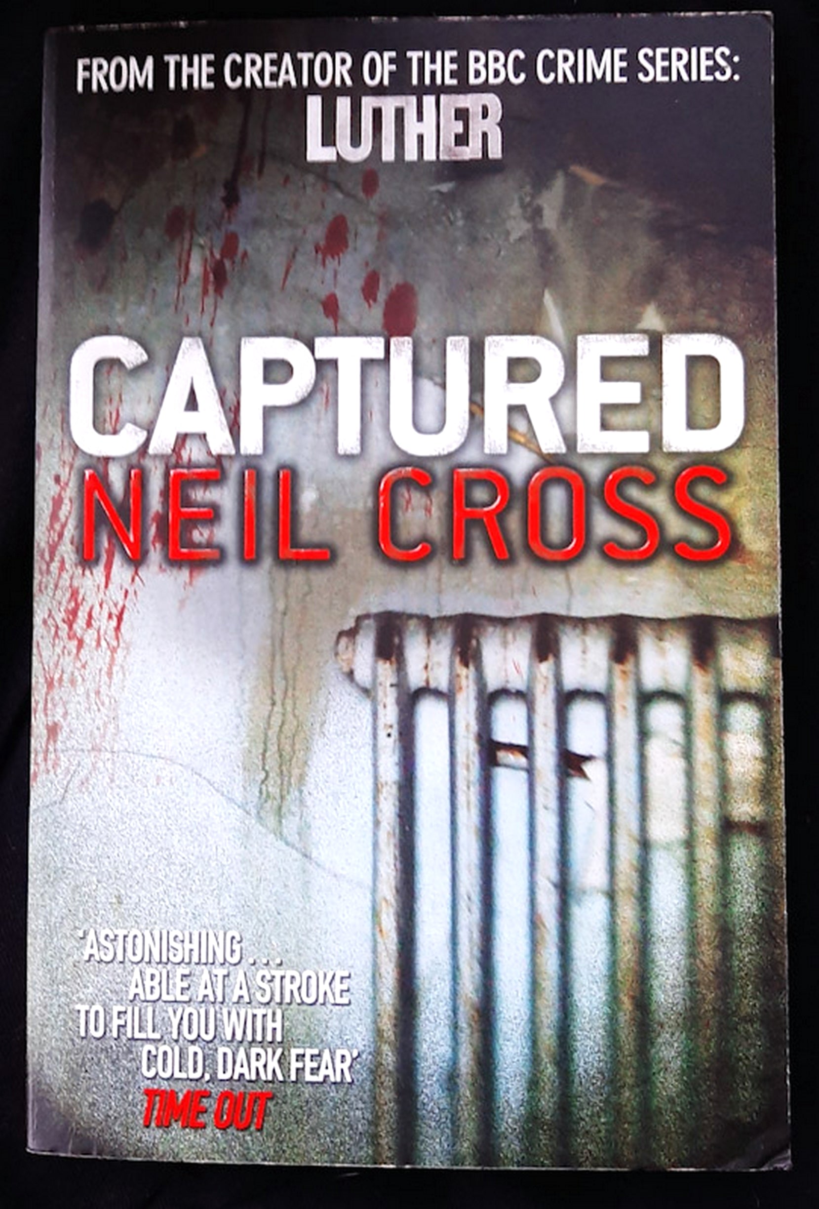 Front Cover Of Captured (Neil Cross)