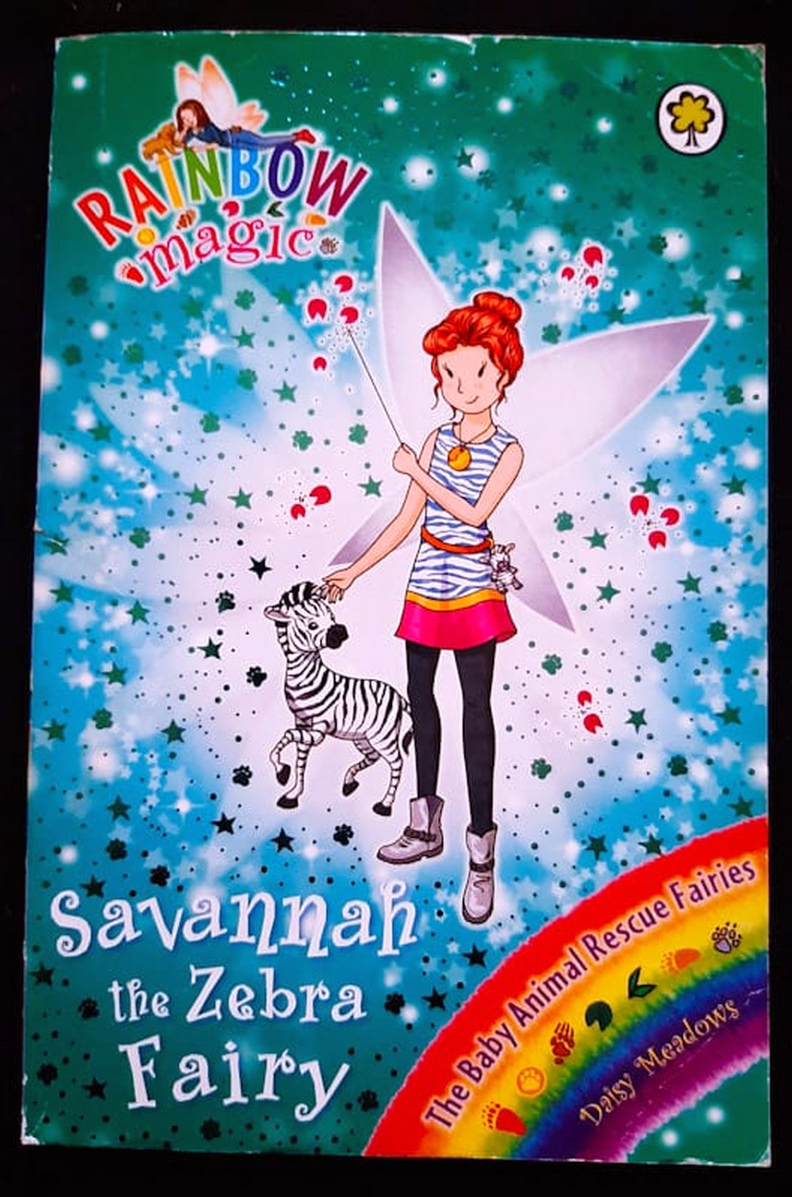 Front Cover Of Bestselling Book Savannah The Zebra Fairy (The Animal Rescue Fairies #4) (Daisy Meadows
)