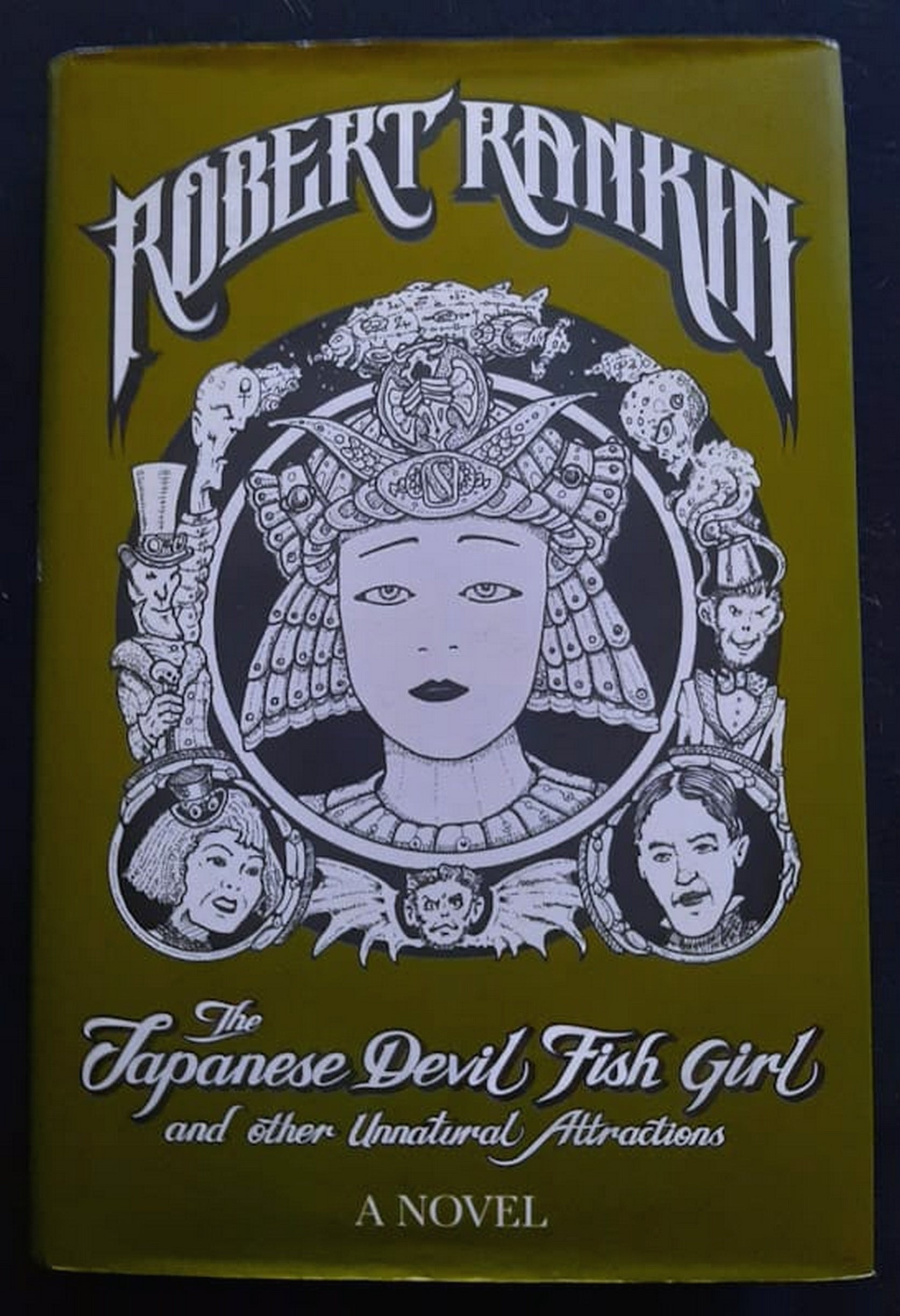 Front Cover Of Bestselling Book The Japanese Devil Fish Girl And Other Unnatural Attractions (Robert Rankin
)