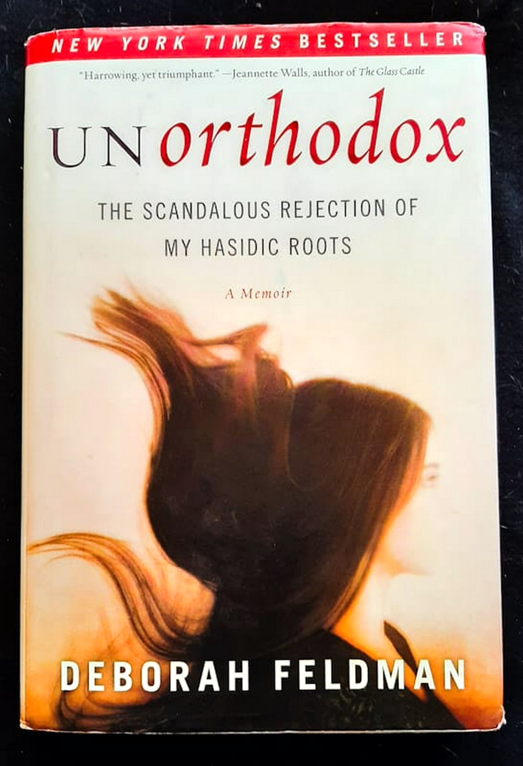 Front Cover Of Bestselling Book Unorthodox: The Scandalous Rejection Of My Hasidic Roots (Deborah Feldman
)