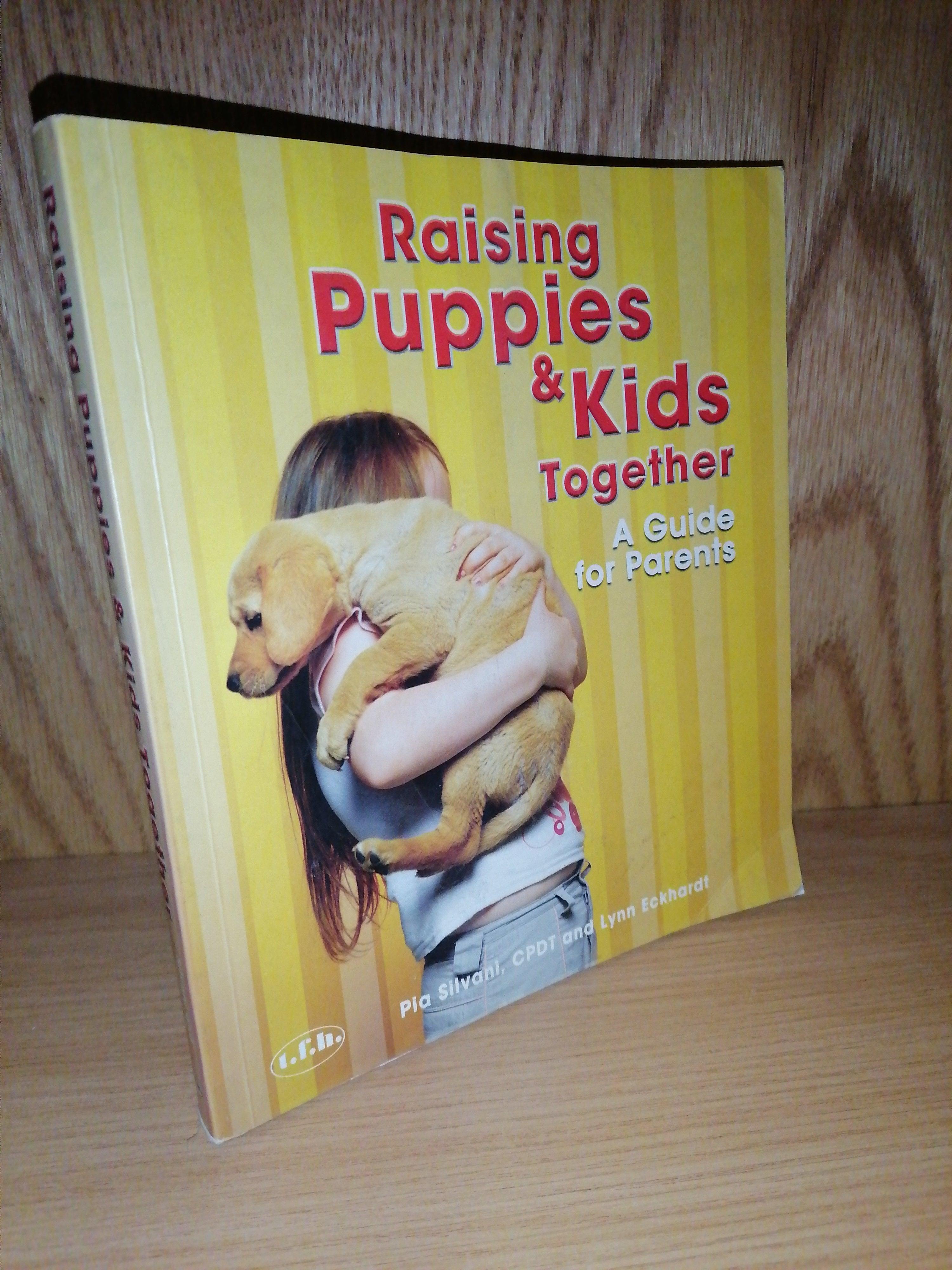 Front Cover Of The Best-Selling Book Raising Puppies Kids Together Lynn Silvani