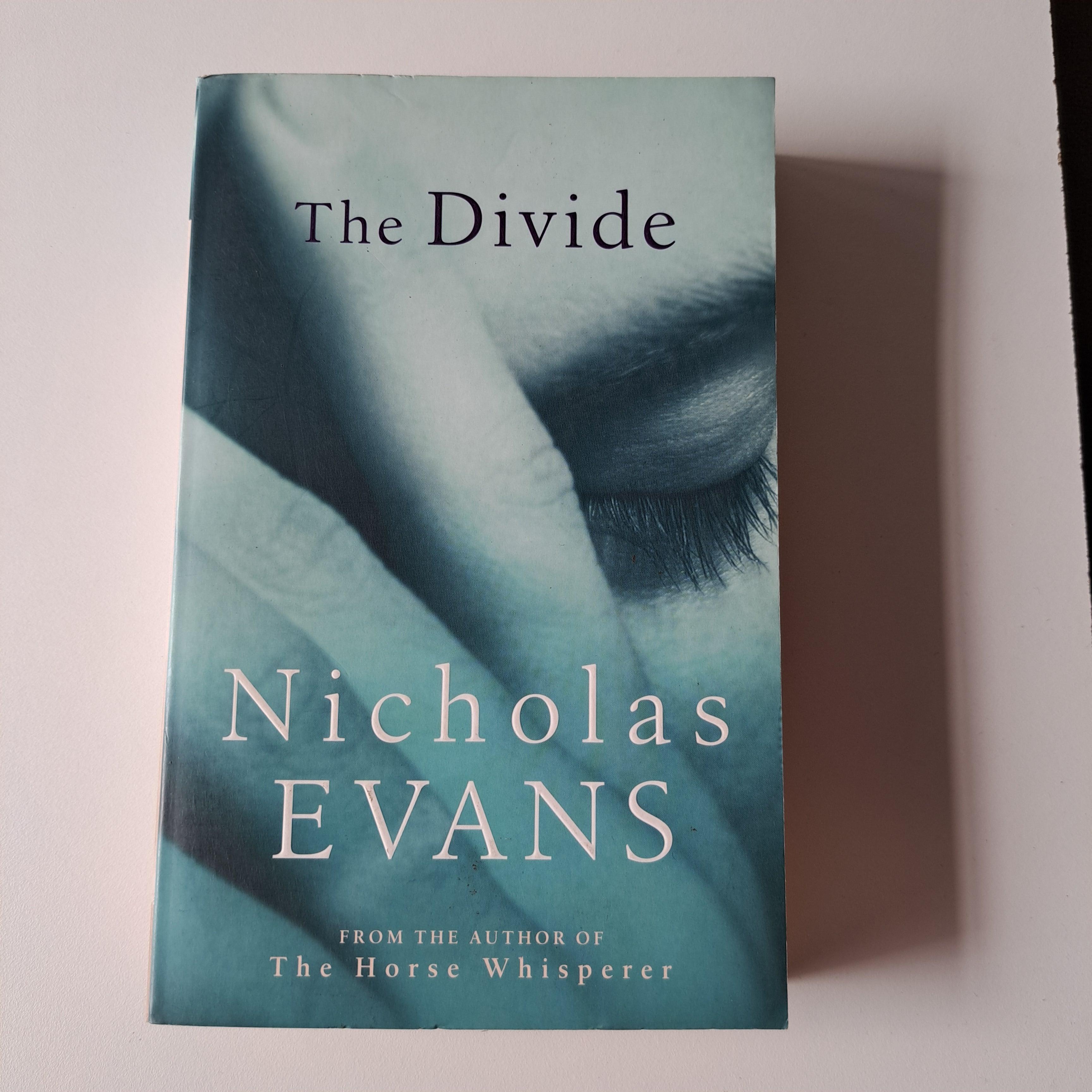 Front Cover Of The Best-Selling Book The Divide Paperback Jan 01, 2006 Nicholas Evans Nicholas Evans