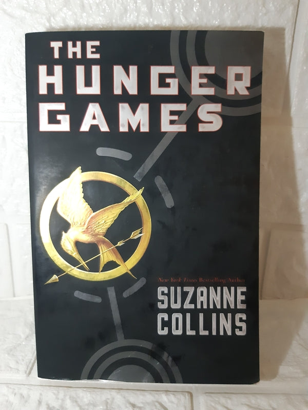 Front Cover Of The ​Hunger Games (Suzanne Collins)