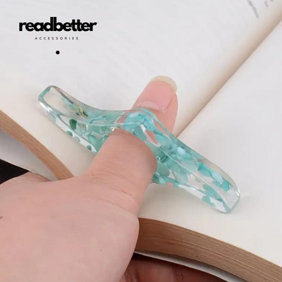 Front Cover Of The Best-Selling Book Aquamarine Thumb Book Holder By ReadBetter