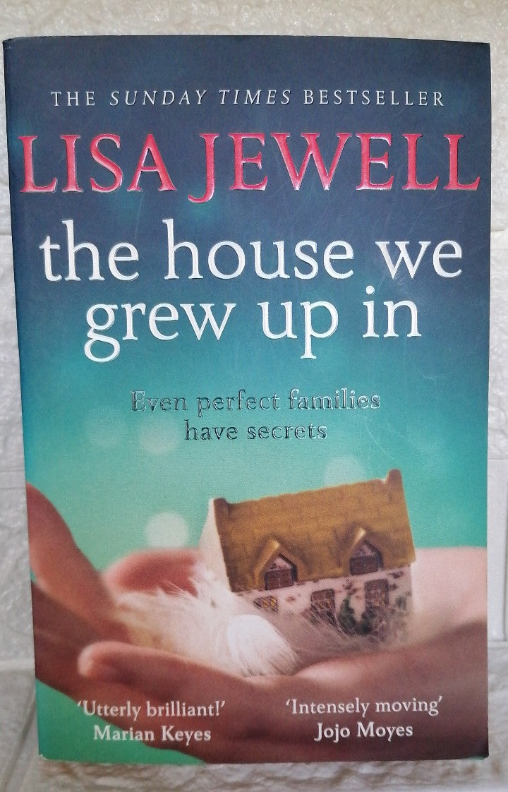 Front Cover Of The House We Grew Up In