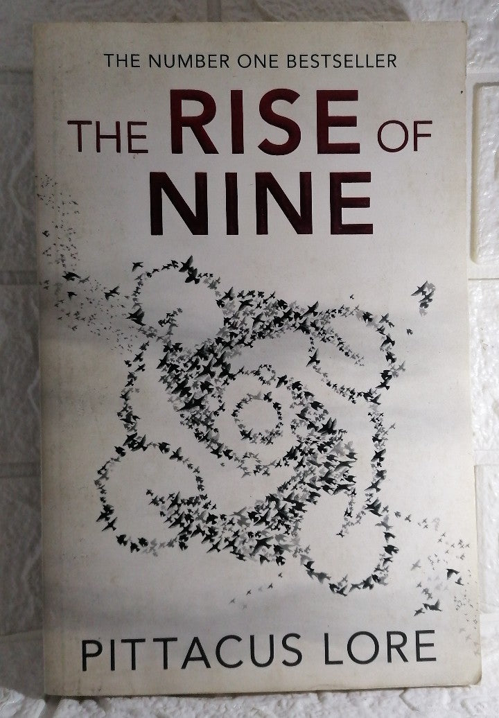Front Cover Of The Rise of Nine (Lorien Legacies, #3) (Pittacus Lore)