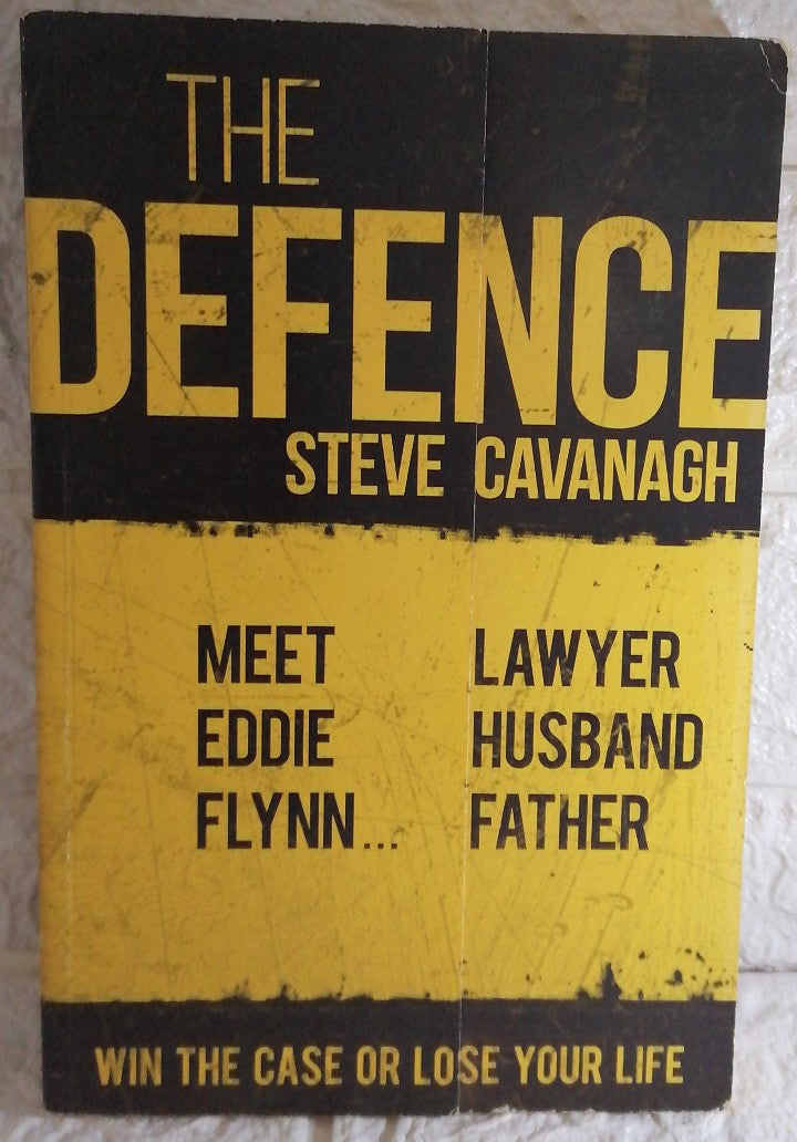 Front Cover Of The Defense (Eddie Flynn, #1) (Steve Cavanagh)