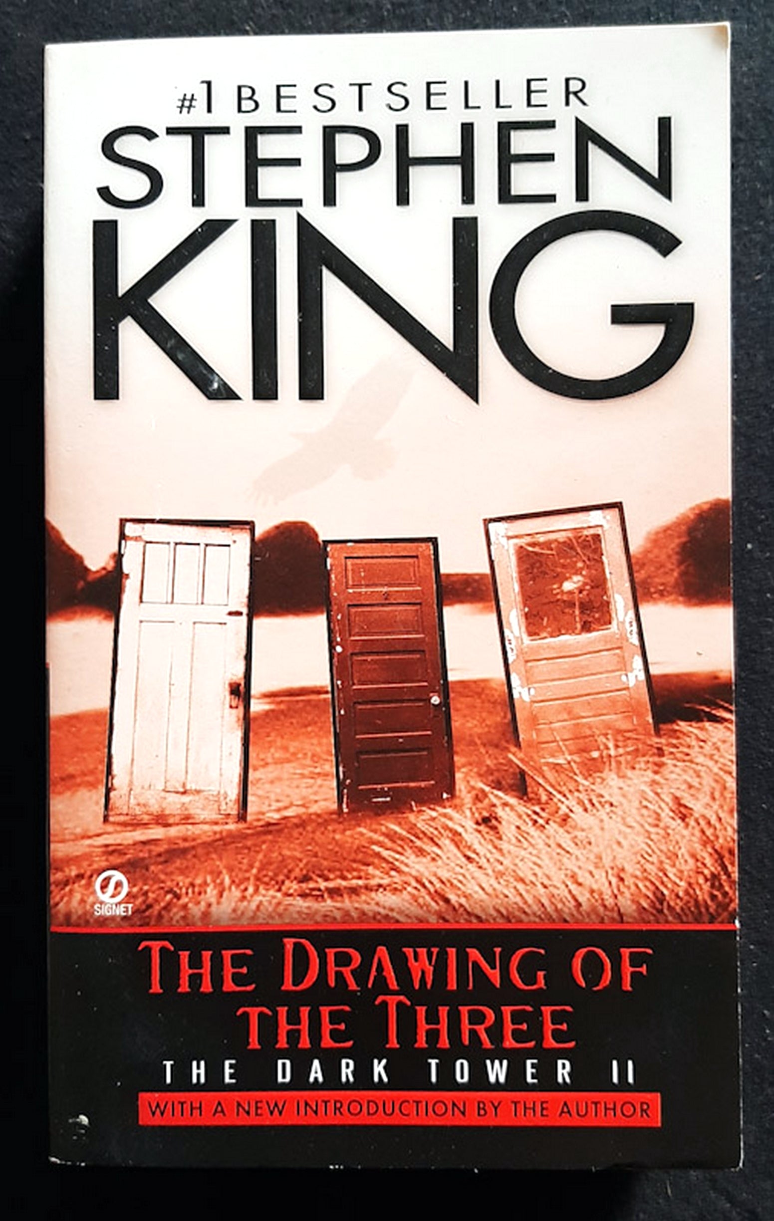 Front Cover Of The Drawing of the Three (The Dark Tower #2) (Stephen King)
