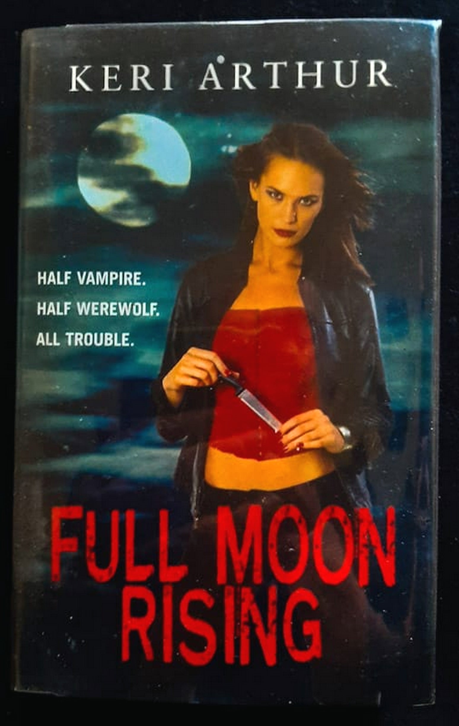 Front Cover Of Full Moon Rising (Riley Jenson Guardian #1) (Keri Arthur)