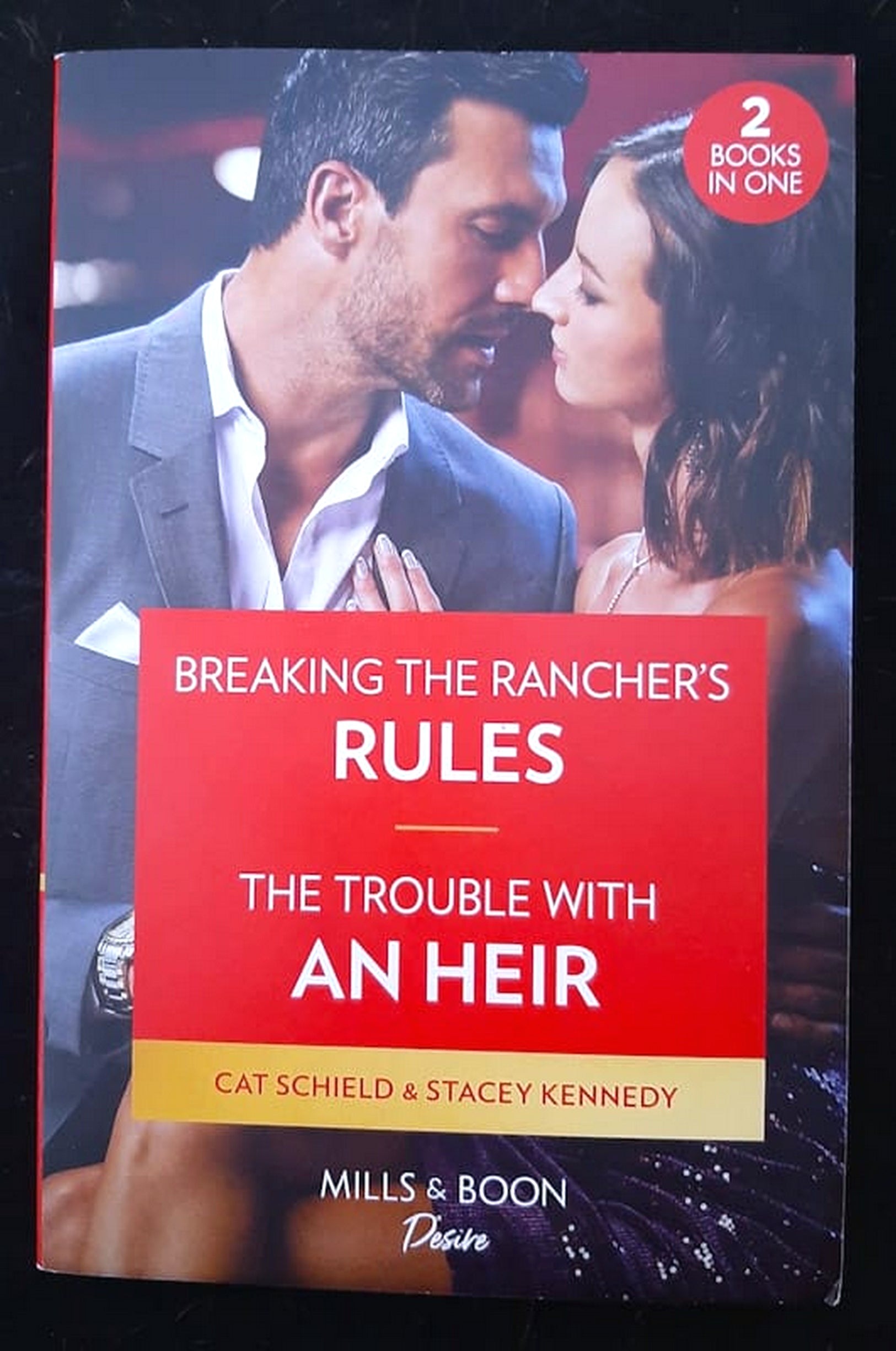 Front Cover Of Breaking The Rancher's Rules / The Trouble With An Heir - 2 Books in 1 (Cat Schield and Stacey Kennedy)