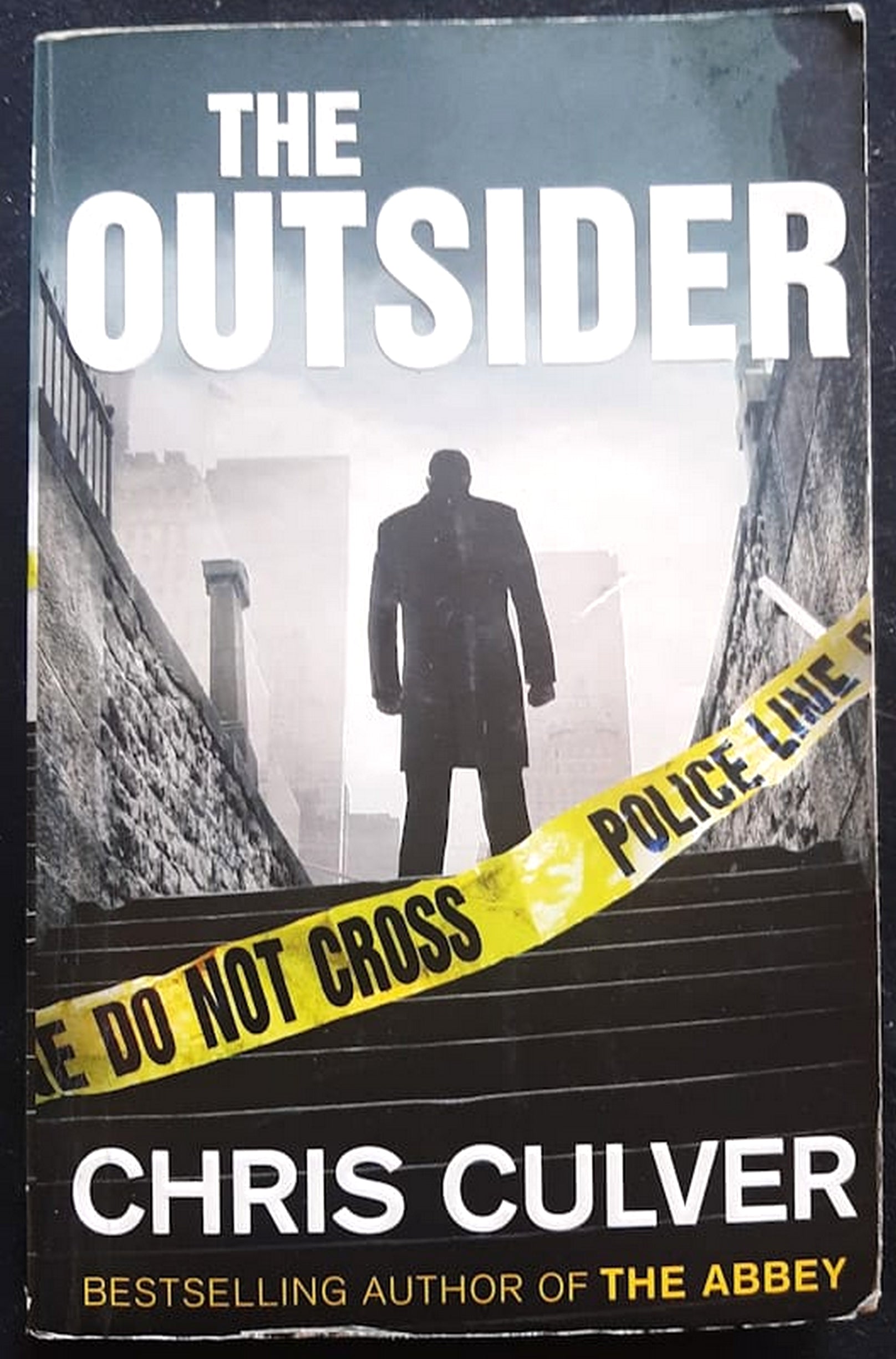 Front Cover Of Bestselling Book The Outsider (Detective Ash Rashid #2) (Chris Culver
)