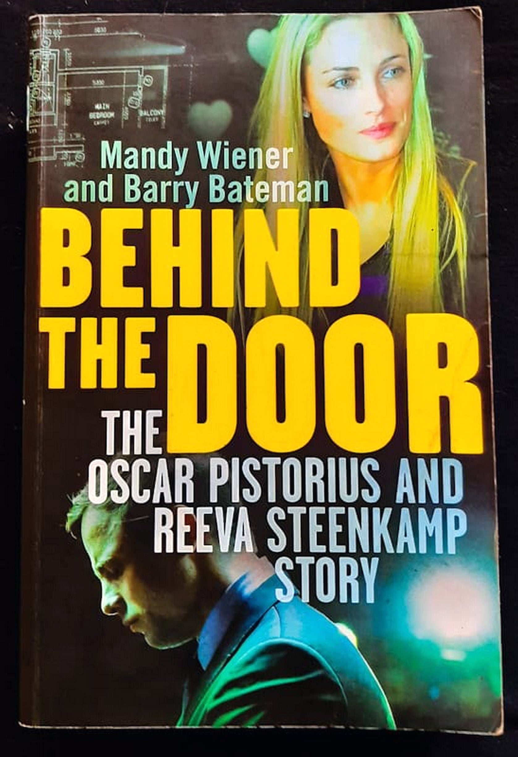Front Cover Of Bestselling Book Behind The Door: The Oscar Pistorius And Reeva Steenkamp Story (Mandy Wiener
)