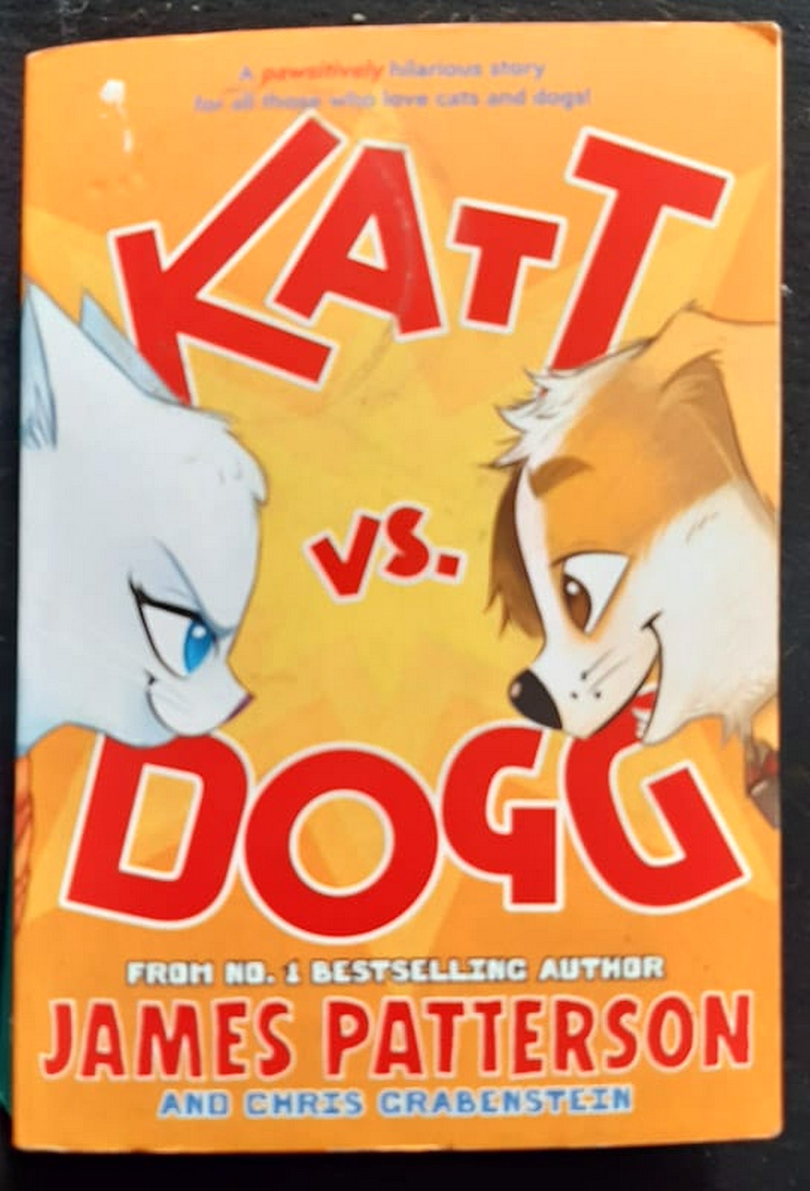 Front Cover Of Bestselling Book Katt Vs. Dogg (Katt Vs. Dogg #1) (James Patterson
)