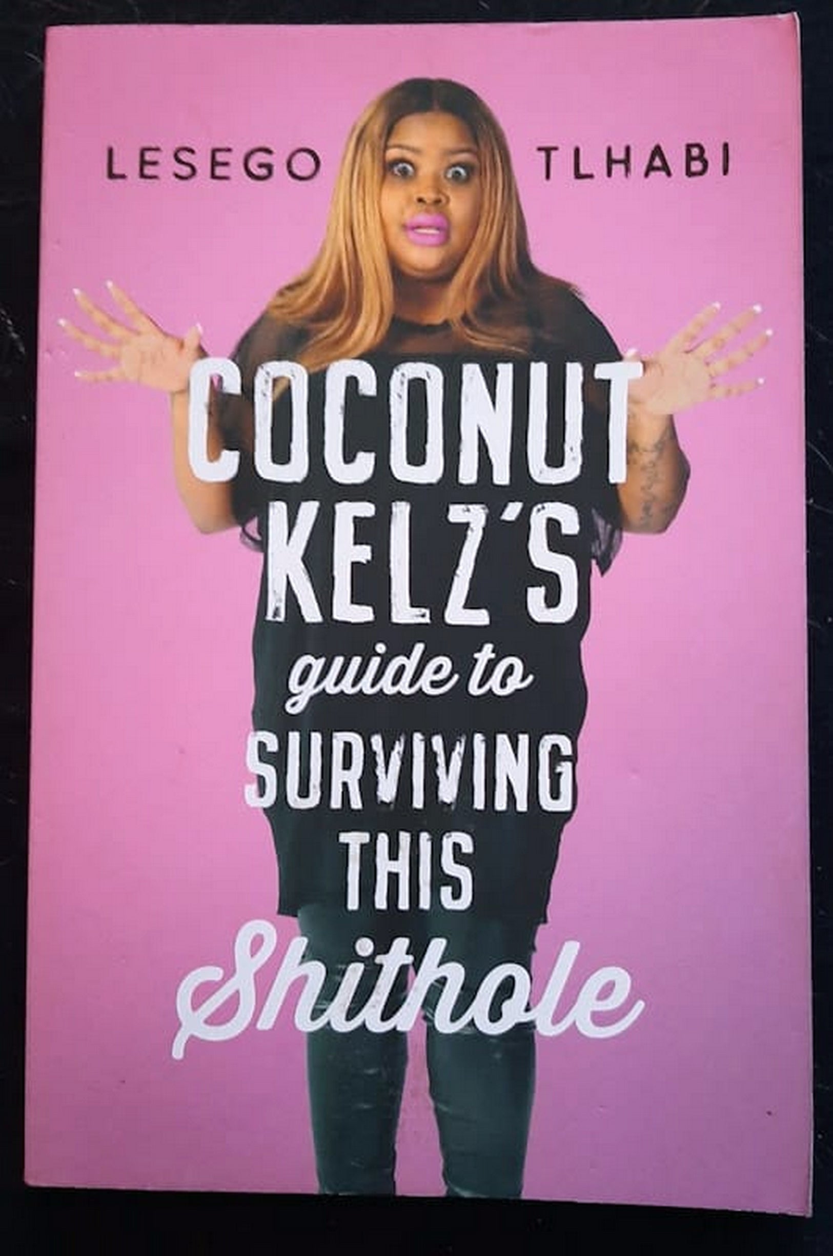 Front Cover Of Bestselling Book Coconut Kelz���S Guide To Surviving This Shithole (Lesego Tl