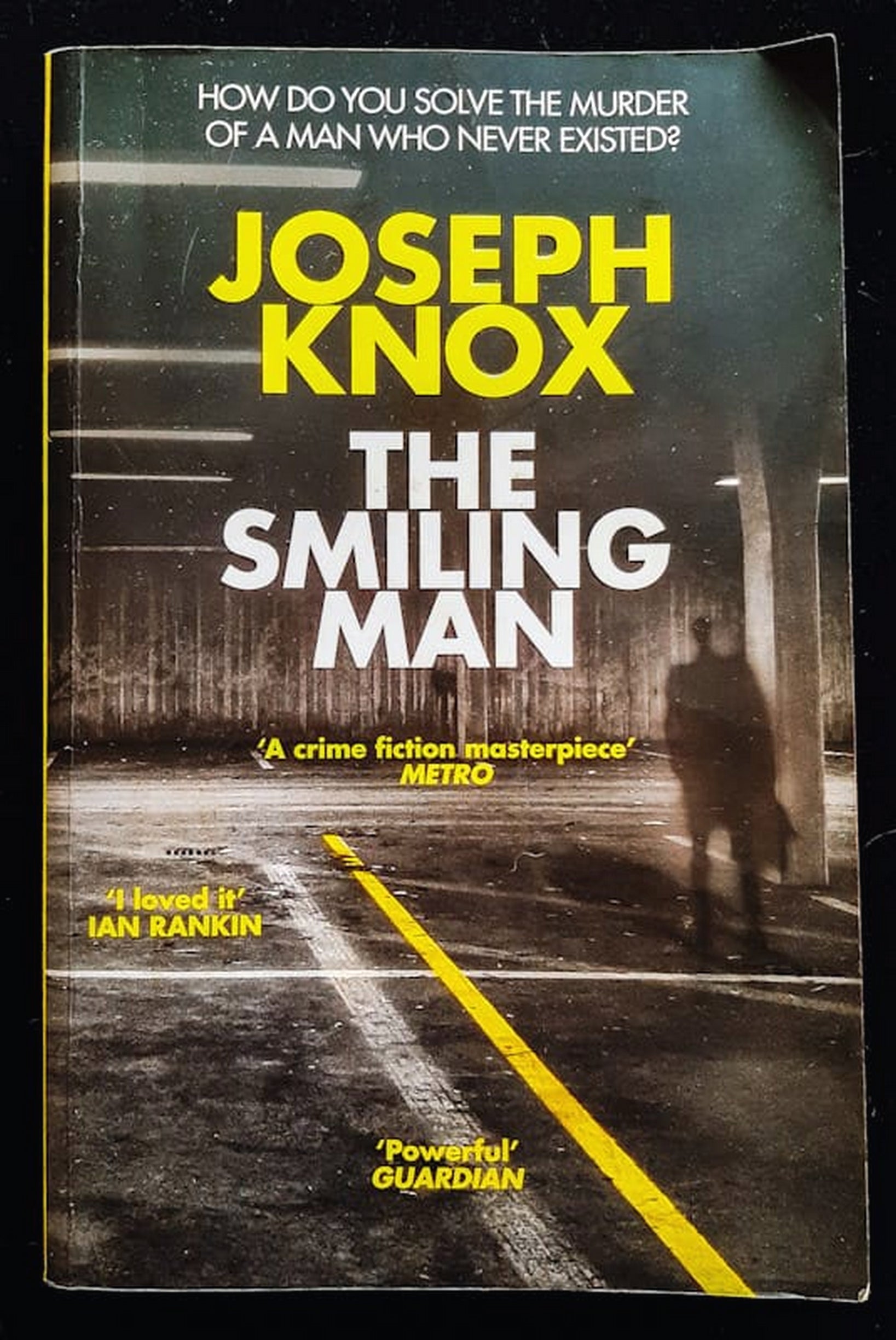 Front Cover Of Bestselling Book The Smiling Man (Aidan Waits Thriller #2) (Joseph Knox
)