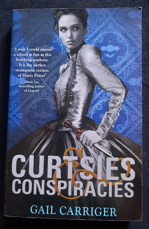 Front Cover Of Curtsies & Conspiracies (Finishing School #2) (Gail Carriger
)