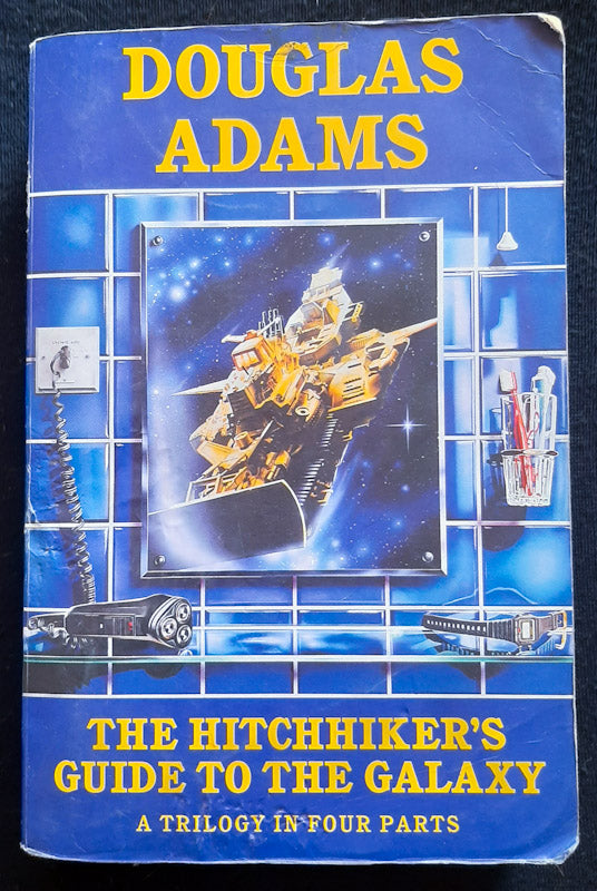 Front Cover Of The Hitchhiker's Guide to the Galaxy: A Trilogy in Four Parts (Douglas Adams
)