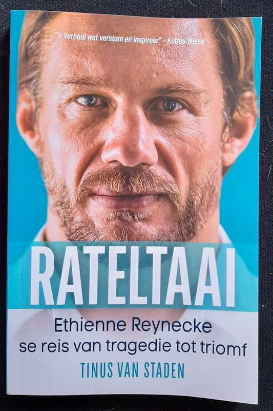 Front Cover Of Rateltaai: Ethienne Reynecke Se Reis Van Tragedie Tot Triomf (Thinus Van Staden
)