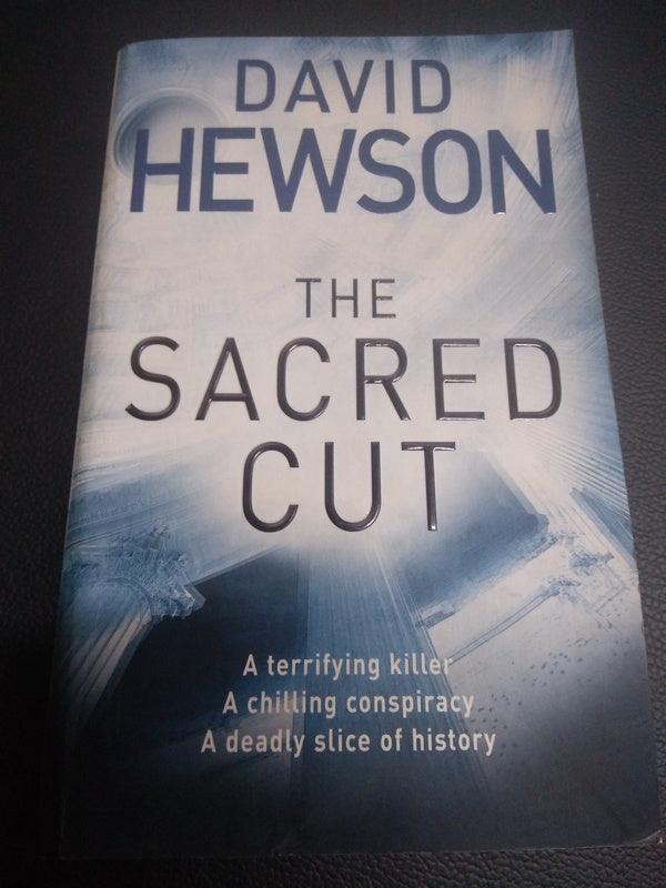 Front Cover Of The Sacred Cut (David Hewson))